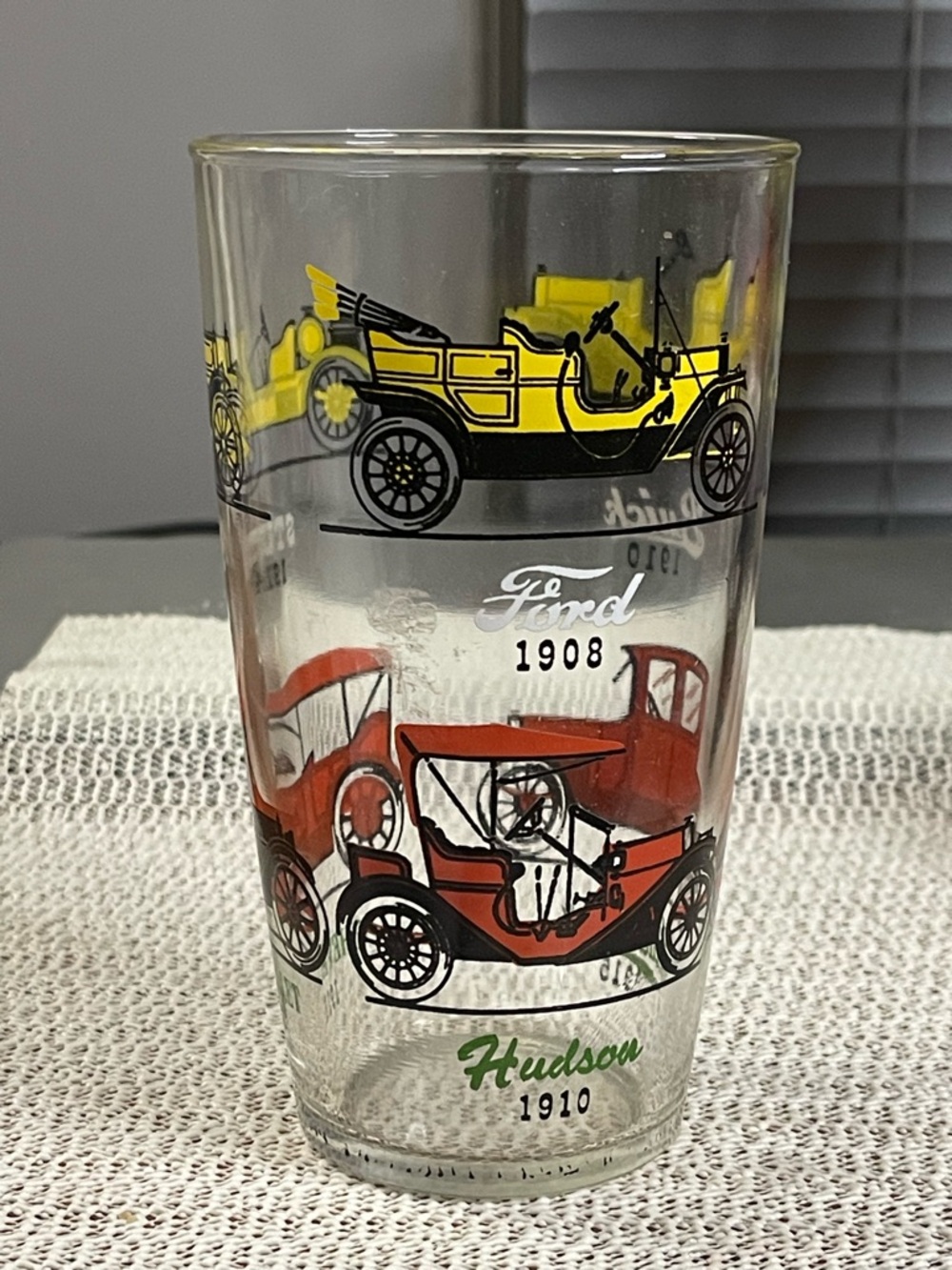 vintage Hazel-Atlas drinking glass featuring illustrations of antique cars